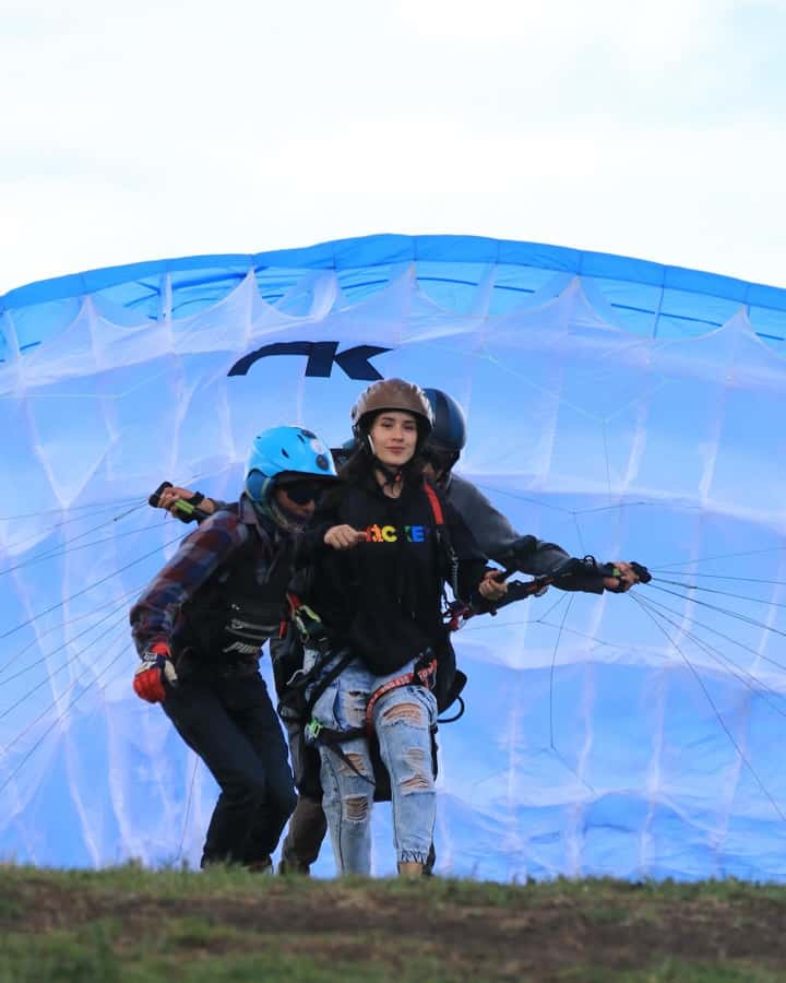 Bogota: Paragliding activity in La Calera with transfers - Preparing for takeoff near Guatavita