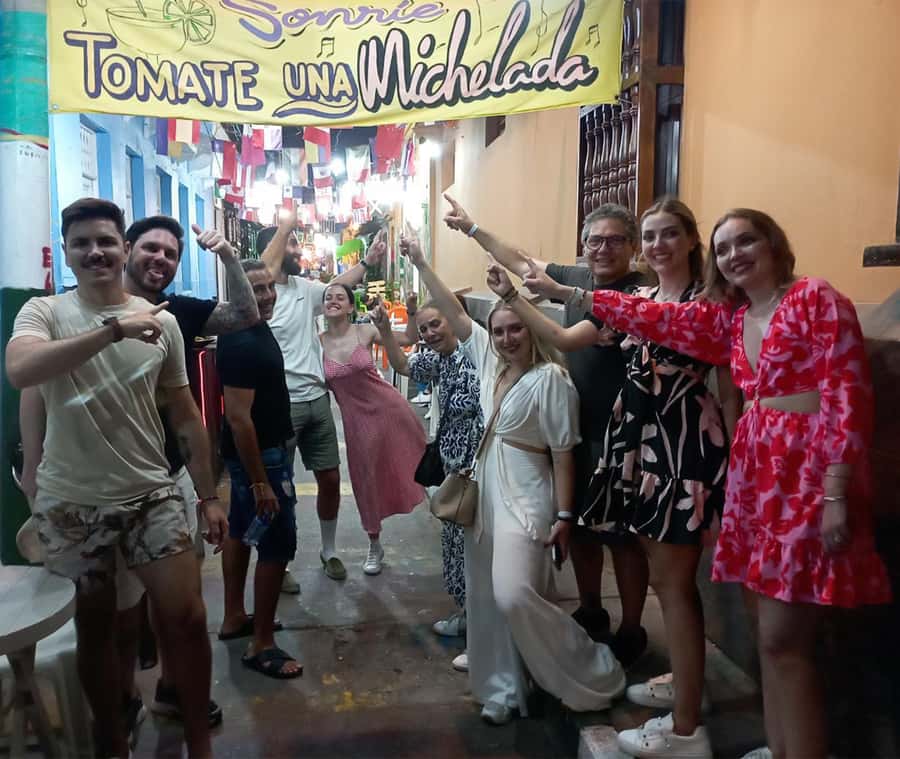 Cartagena: Historic Center and Getsemaní Shared Walking Tour - Getsemaní shows Cartagena after dark and in motion