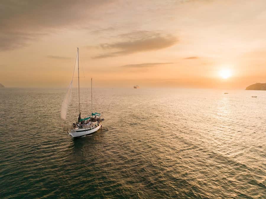 From Santa Marta: Sunset Sailboat Tour with 2 Beverages - Sailing out of Santa Marta at sunset