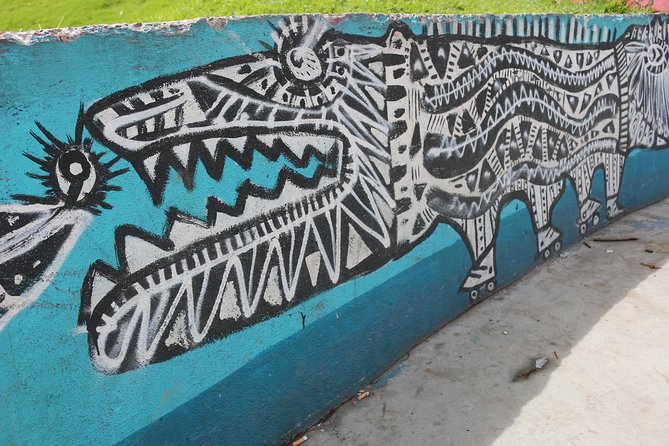 Graffiti Tour in La Candelaria Bogotá with Transportation - A narrow street devoted to Indigenous ancestry