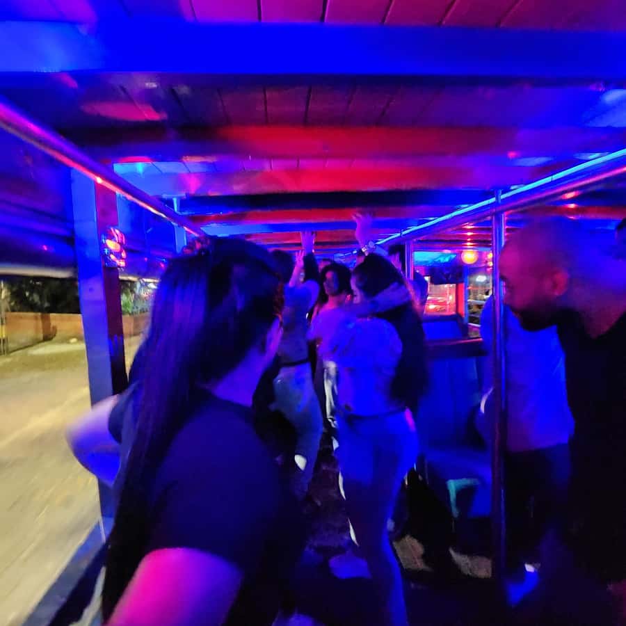 Medellin: Party Bus with DJ & Street Food Tastings - What the guides add to the experience